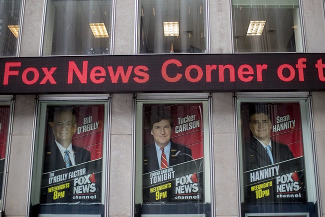 Posters of Fox News Channel personalities are displayed at the News Corp. headquarters in New York, Wednesday, April 19, 2017. 