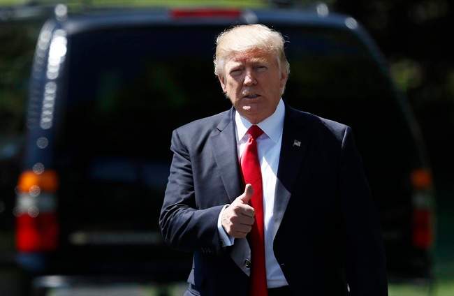 President Donald Trump gives a thumbs-up as he walks to board Marine One on the South Lawn of the White House in Washington, in this April 18, 2017 file photo.