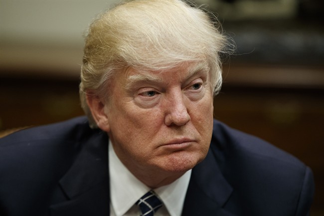 In this Tuesday, March 28, 2017, file photo, President Donald Trump listens during a meeting with the Fraternal Order of Police, in the Roosevelt Room of the White House in Washington.