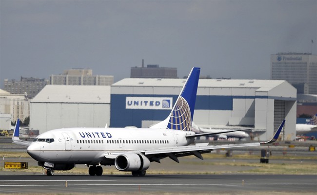 In this Sept. 8, 2015, file photo, a United Airlines passenger plane lands at Newark Liberty International Airport in Newark, N.J. 