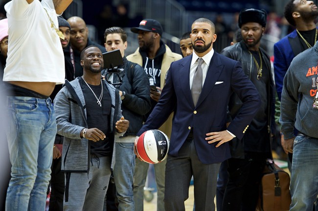 FILE - In this Feb. 12, 2016, file photo, Kevin Hart, left, and Drake coach at the NBA All-Star Celebrity Game at Ricoh Coliseum in Toronto. The league announced on April 25, 2017, that Drake will host its first NBA Awards on June 26. (Photo by Ryan Emberley/Invision/AP, File).