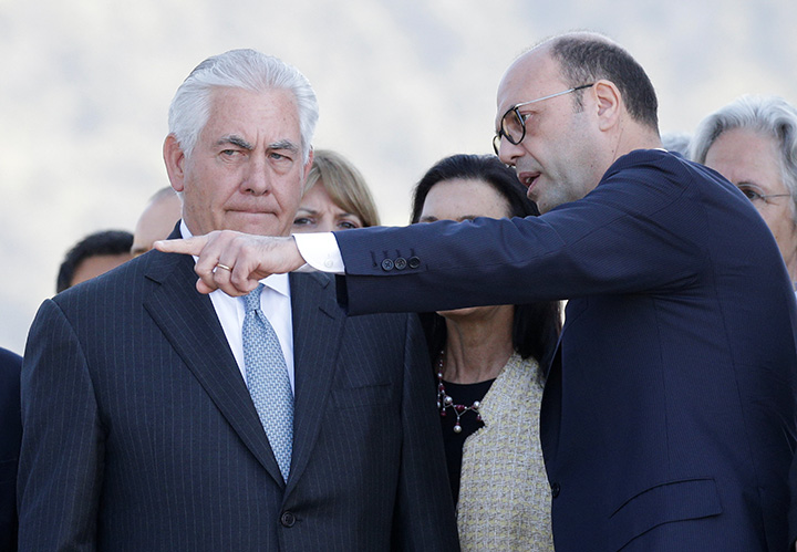Italy's Foreign Minister Angelino Alfano (R) gestures as he talks with U.S. Secretary of State Rex Tillerson during a ceremony at the Sant'Anna di Stazzema memorial in Italy on April 10, 2017. 