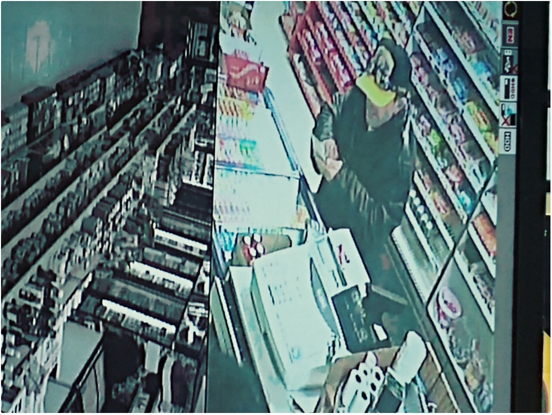 The photo of a suspect wanted by London police in connection to a robbery at a downtown business.