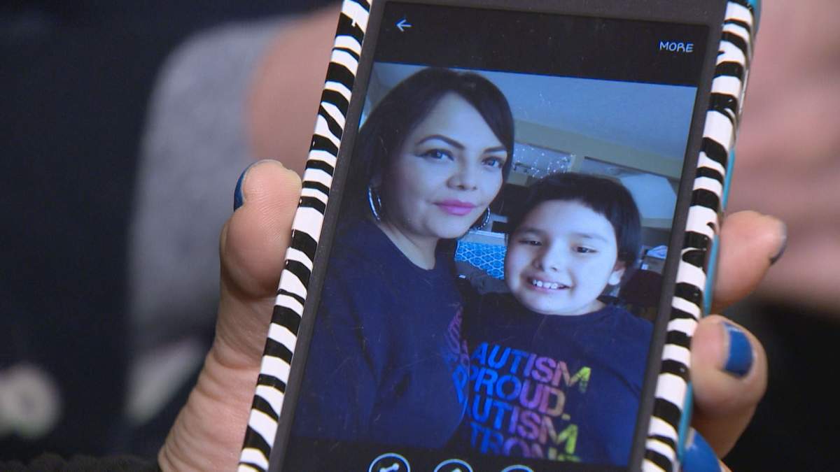 Jeanelle Mandes shows a photo of herself and daughter, Sharlize.