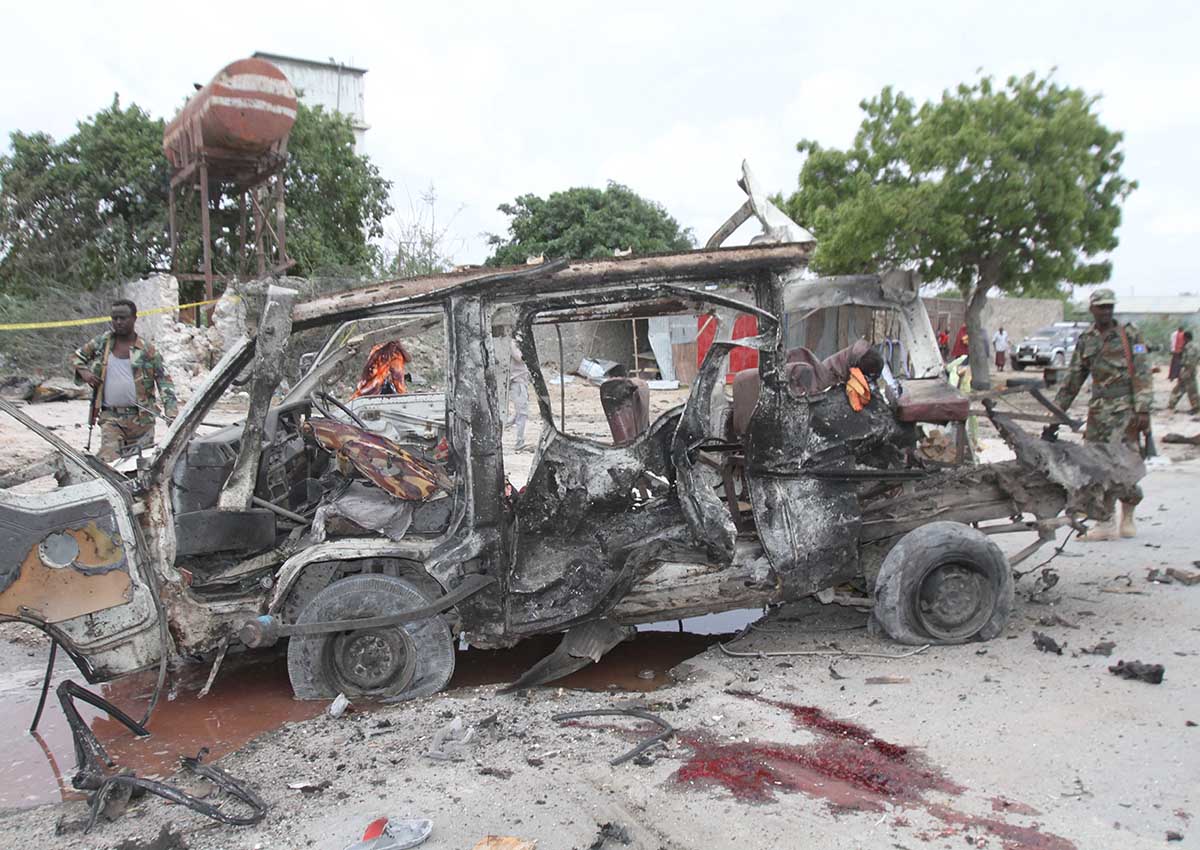 Military personnel at the scene of a suicide car bomb attack outside a military base in Mogadishu, Somalia, 09 April 2017. Early reports state that at least four people died in the attack that was aimed at senior officials leaving the base. 