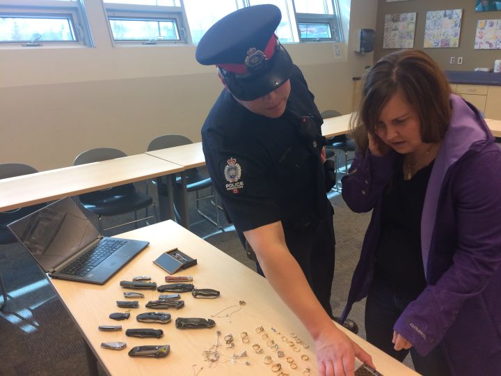 Police return stolen items to an Edmonton woman whose home was broken into earlier this week. 
