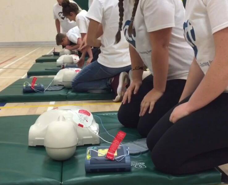 Aldershot high school students demonstrate CPR/AED skills.
