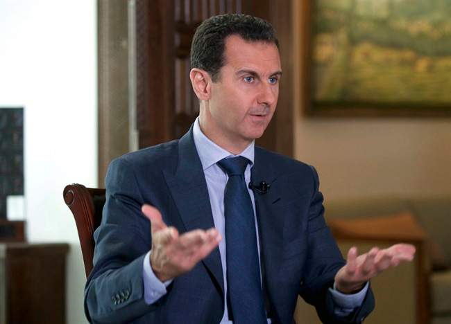 Syrian President Bashar Assad speaks to The Associated Press at the presidential palace in Damascus, Syria. U.S. 