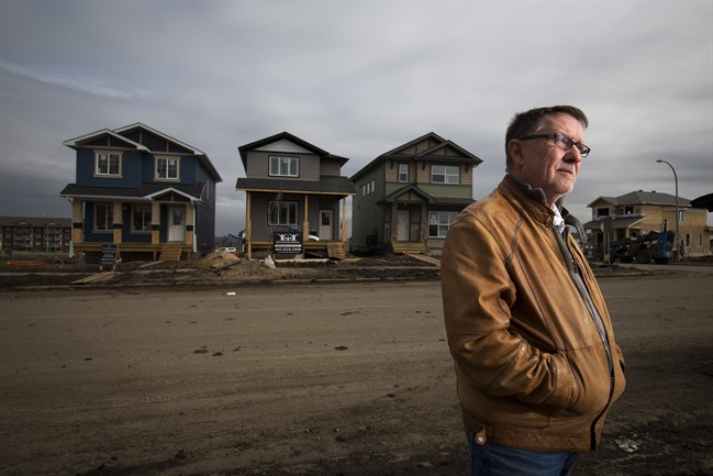 Gilles Huizinga president of the local Urban Development Institute and a homebuilder with Sedgewood Homes with newly built homes in the Timberlea area that was destroyed by wildfires last year in Fort McMurray, Alta. Thursday, April 20, 2017. 