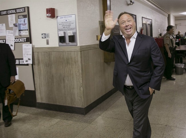 In this April 19, 2017, file photo, Alex Jones, a well-known Austin-based broadcaster and provocateur, arrives for a child custody trial at the Heman Marion Sweatt Travis County Courthouse in Austin, Texas.