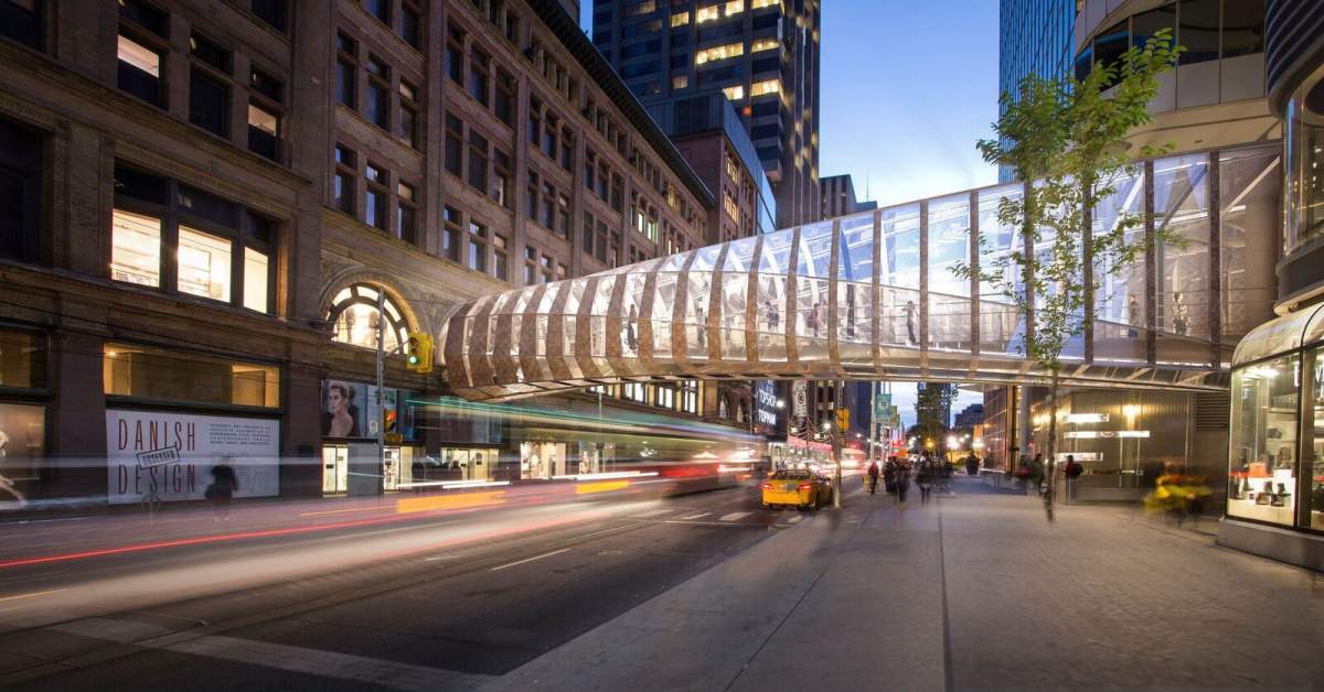 Image of the new CF Toronto Eaton Centre pedestrian bridge over Queen Street.