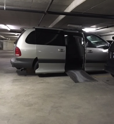 Sherry Caves is forced to park halfway out of her parking spot in order to deploy her ramp.