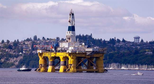 FILE - In this May 14, 2015 file photo, the oil drilling rig Polar Pioneer is towed toward a dock in Elliott Bay in Seattle. 