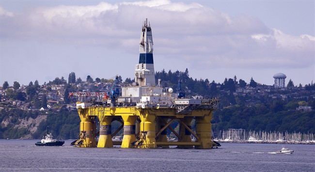 FILE - In this May 14, 2015 file photo, the oil drilling rig Polar Pioneer is towed toward a dock in Elliott Bay in Seattle. 