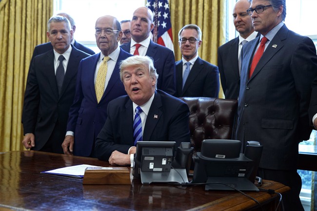In this March 24, 2017, file photo, President Donald Trump announces the approval of a permit to build the Keystone XL pipeline.