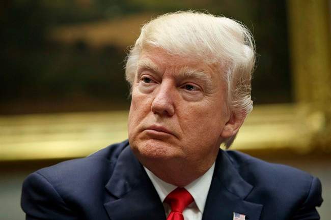  In this Friday, March 31, 2017 file photo, President Donald Trump listens during a meeting with the National Association of Manufacturers in the Roosevelt Room of the White House in Washington. 