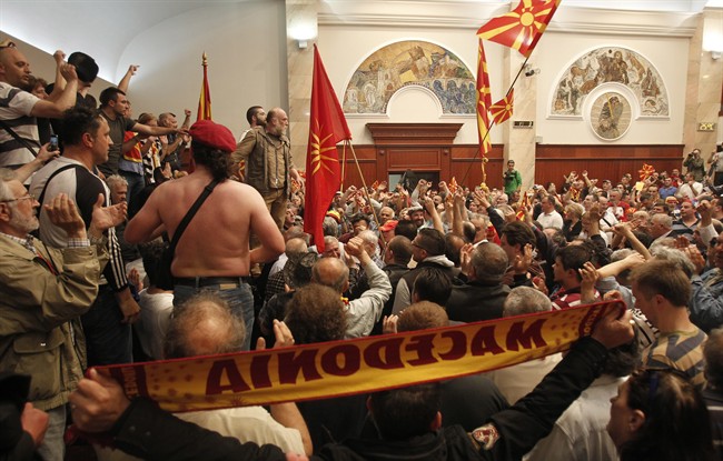 Protestors enter into the parliament building in Skopje, Macedonia, Thursday, April 27, 2017. 