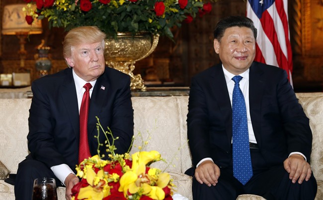  In this April 6, 2017, file photo, President Donald Trump and Chinese President Xi Jinping sit as they pose for photographers before a meeting at Mar-a-Lago in Palm Beach, Fla.