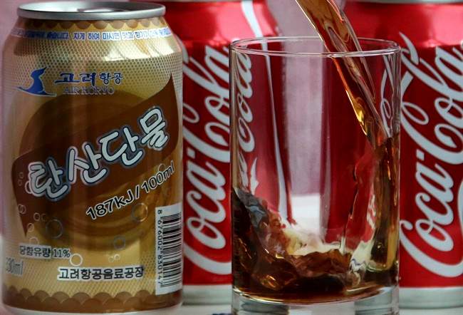 In this Tuesday, April 11, 2017, photo, a can of Air Koryo cola, produced by Air Koryo, the country's flagship airline which recently introduced its own brand of cola on flights to and from Beijing is seen in Pyongyang, North Korea. Coca Cola is possibly the world's most recognizable brand, an almost inescapable symbol of the global appeal of American-style consumer culture. There are only two countries in the world where Coke doesn't officially operate, and one of them is North Korea.