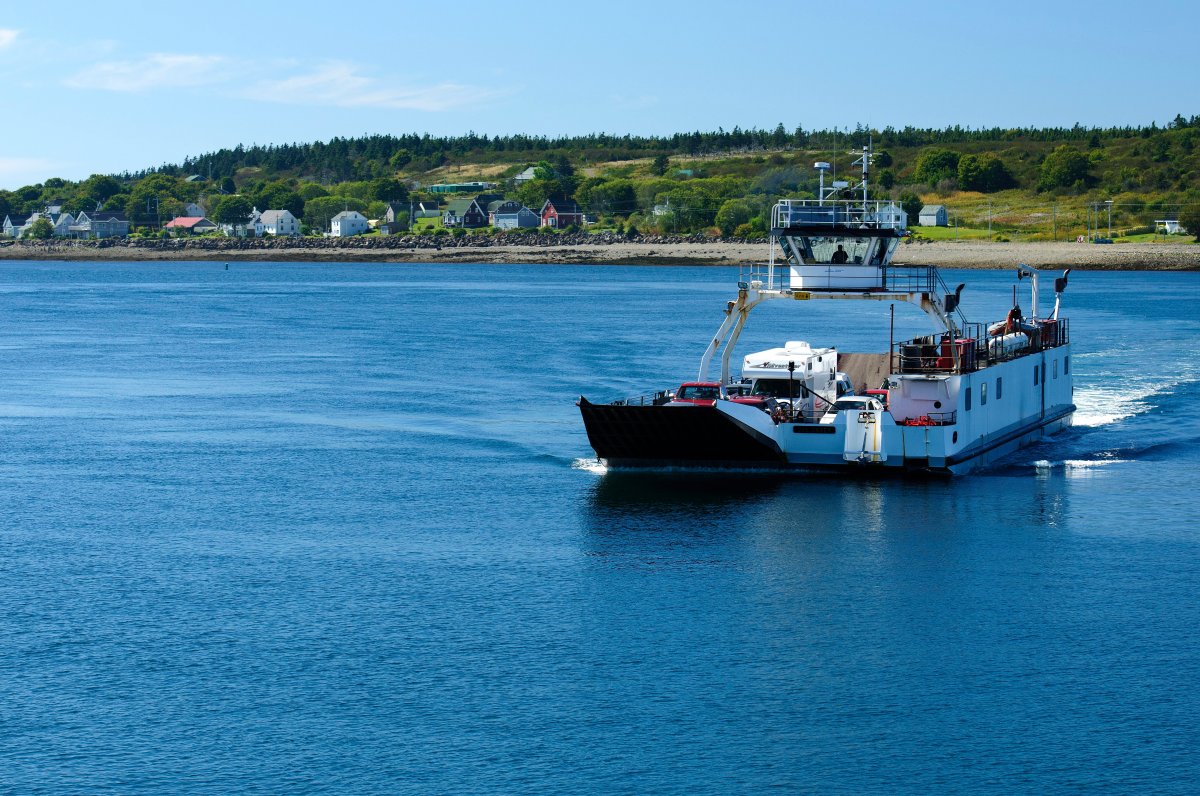 Vehicle/passenger ferry travelling from Tiverton, background, to East Ferry on the Digby Neck in Nova Scotia.