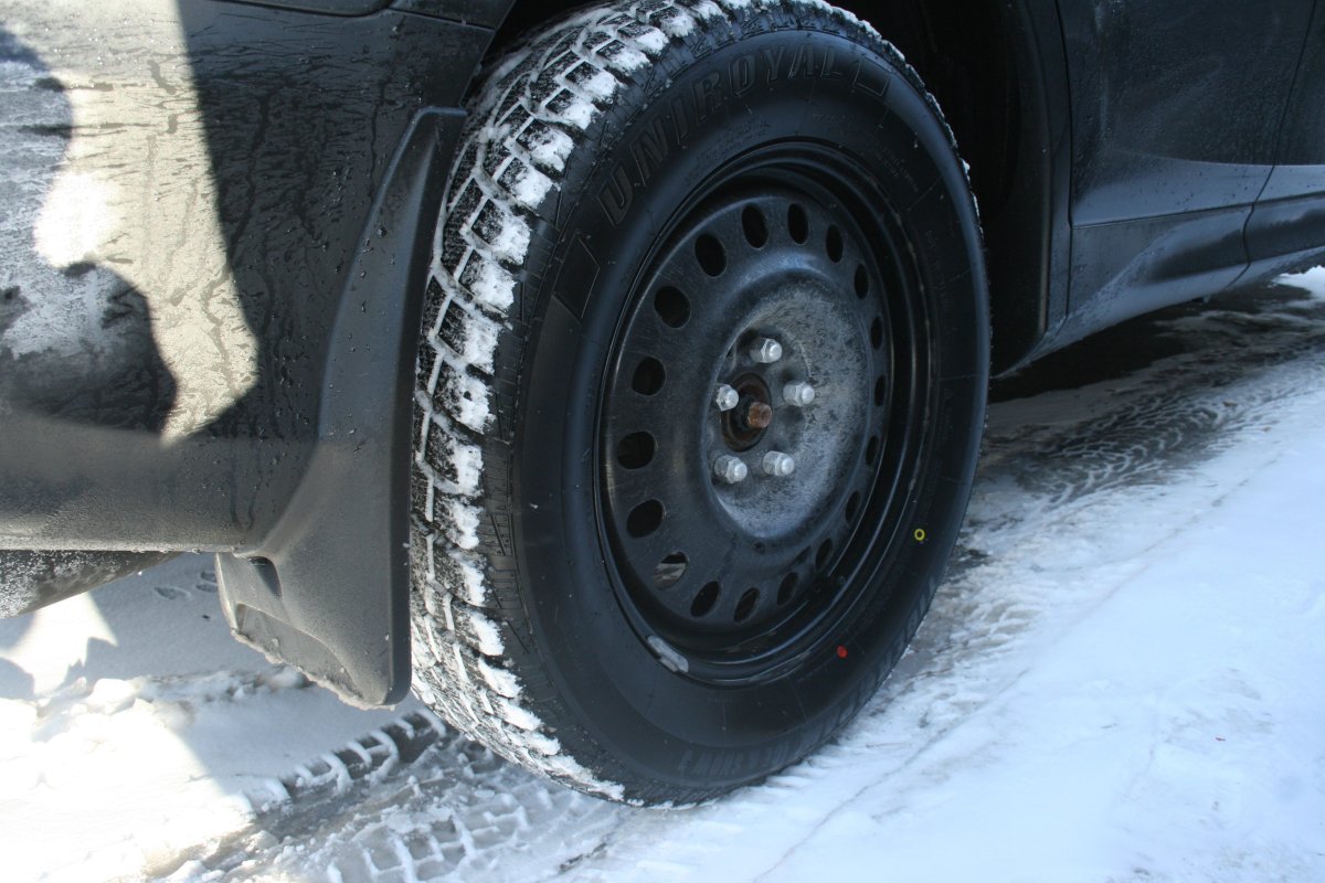 A snow tire is shown on a vehicle in Oakville, Ont., Dec.15, 2016. Winter tires are designed with highly specialized rubber compounds that stay flexible in cold weather and have tread patterns designed to grip and bite into snow or ice. THE CANADIAN PRESS IMAGES/Richard Buchan.