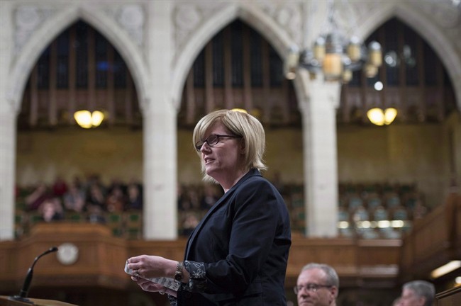 Minister of Sport and Persons with Disabilities Carla Qualtrough rises during Question Period in the House of Commons on Parliament Hill, Friday, April 7, 2017 in Ottawa.