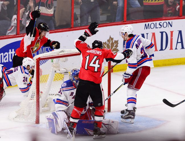 Ottawa Senators centre Kyle Turris (7) celebrates his goal on New York Rangers goalie Henrik Lundqvist (30) with Senators left wing Alex Burrows (14) during the first overtime period in game five of a second-round NHL hockey Stanley Cup playoff series in Ottawa on Saturday, May 6, 2017. 