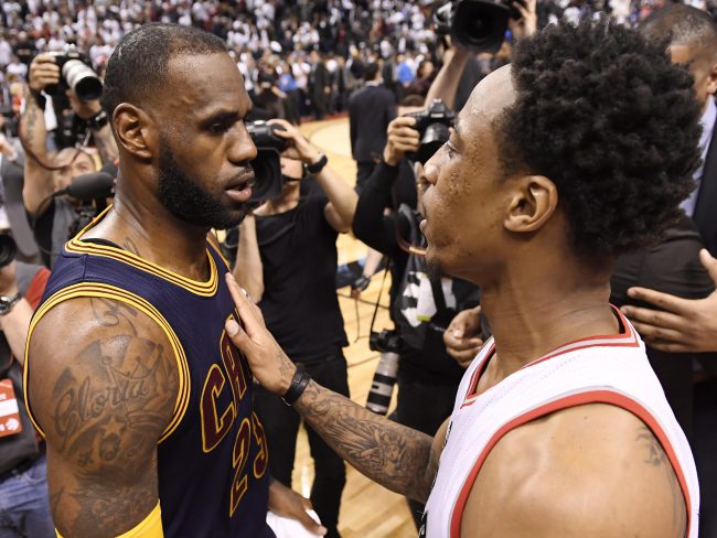 Toronto Raptors' star DeMar DeRozan, right, scored 21 points in Wednesday night's loss in Cleveland. Cavaliers' star LeBron James, left, netted 35 points.