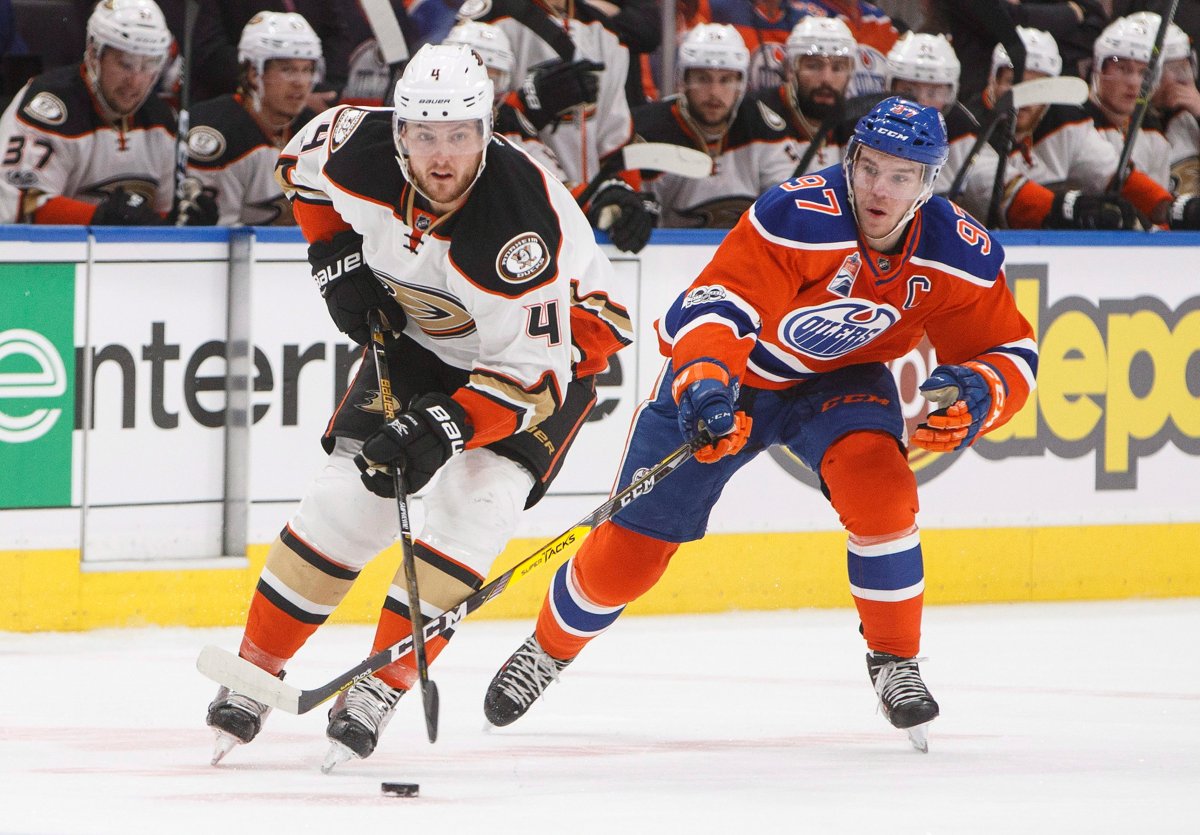Edmonton Oilers left wing Milan Lucic, top, and Anaheim Ducks defenseman  Cam Fowler battle for the puck during the third period in Game 2 of a  second-round NHL hockey Stanley Cup playoff