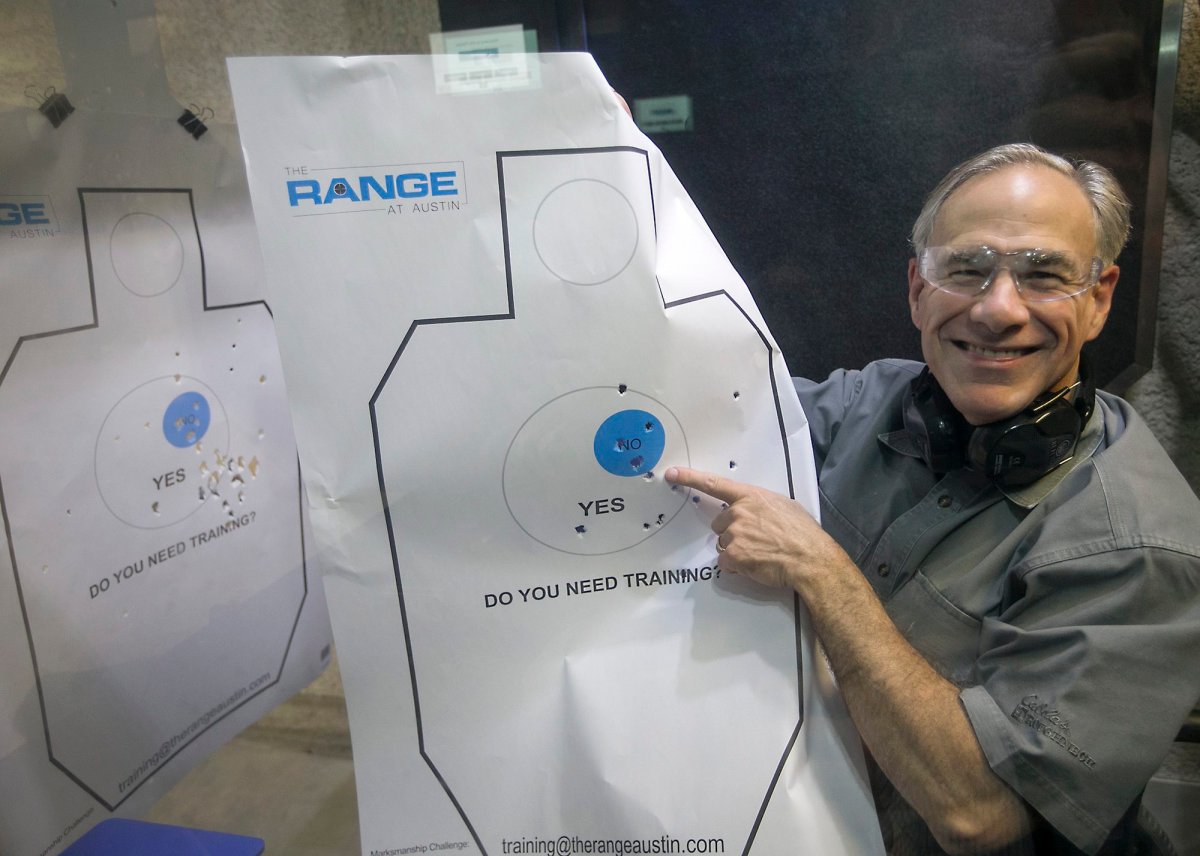 After signing into law Senate Bill 16, legislation lowering the license to carry fee, Texas Gov. Greg Abbott takes target practice as he shows his shooting prowess by displaying his target sheet to the media, at The Range in South Austin under the guidance of Director of Training Jeff Gonzales Friday, May 26, 2017.  