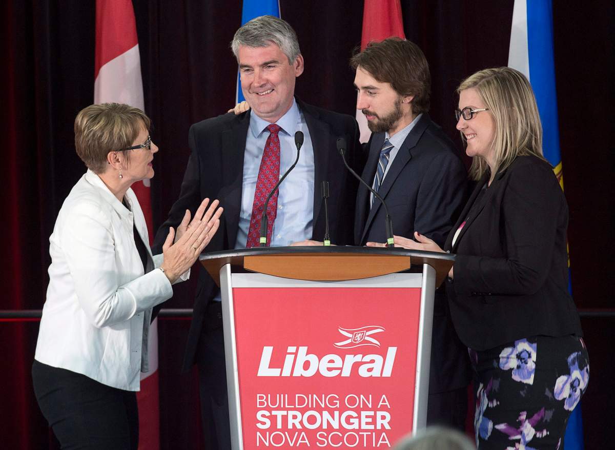Nova Scotia Premier Stephen McNeil is embraced by his wife Andrea, daughter Colleen and son Jeffrey as he addresses the crowd at his election-night celebration in Bridgetown, N.S. on Tuesday, May 30, 2017.