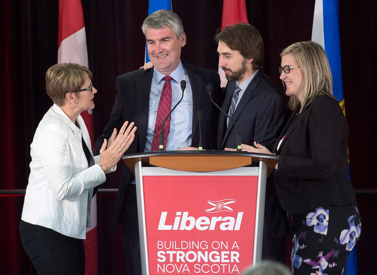 Nova Scotia Premier Stephen McNeil is embraced by his wife Andrea, daughter Colleen and son Jeffrey as he addresses the crowd at his election night celebration in Bridgetown, N.S. on Tuesday, May 30, 2017. 