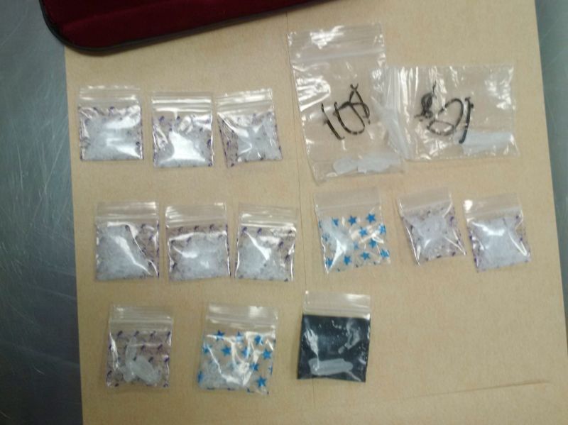 Calgary police display items seized during a week-long operation focusing on drug trafficking and drug-related crime in the downtown core.