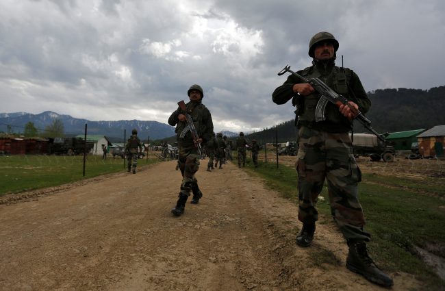 Indian army soldiers patrol inside their army base after it was attacked by suspected separatist militants in Panzgam in Kashmir's Kupwara district, April 27, 2017. 