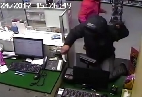 The suspect in a "violent" robbery at Ranchlands Pharmacy on Wednesday is seen in surveillance footage. 