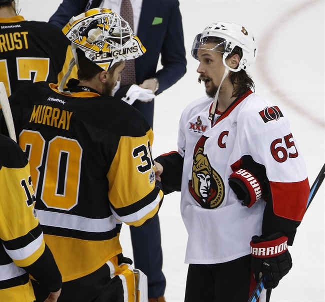 Pittsburgh Penguins goalie Matt Murray (30) and the Ottawa Senators' Erik Karlsson meet in the handshake line in this 2017 file photo.