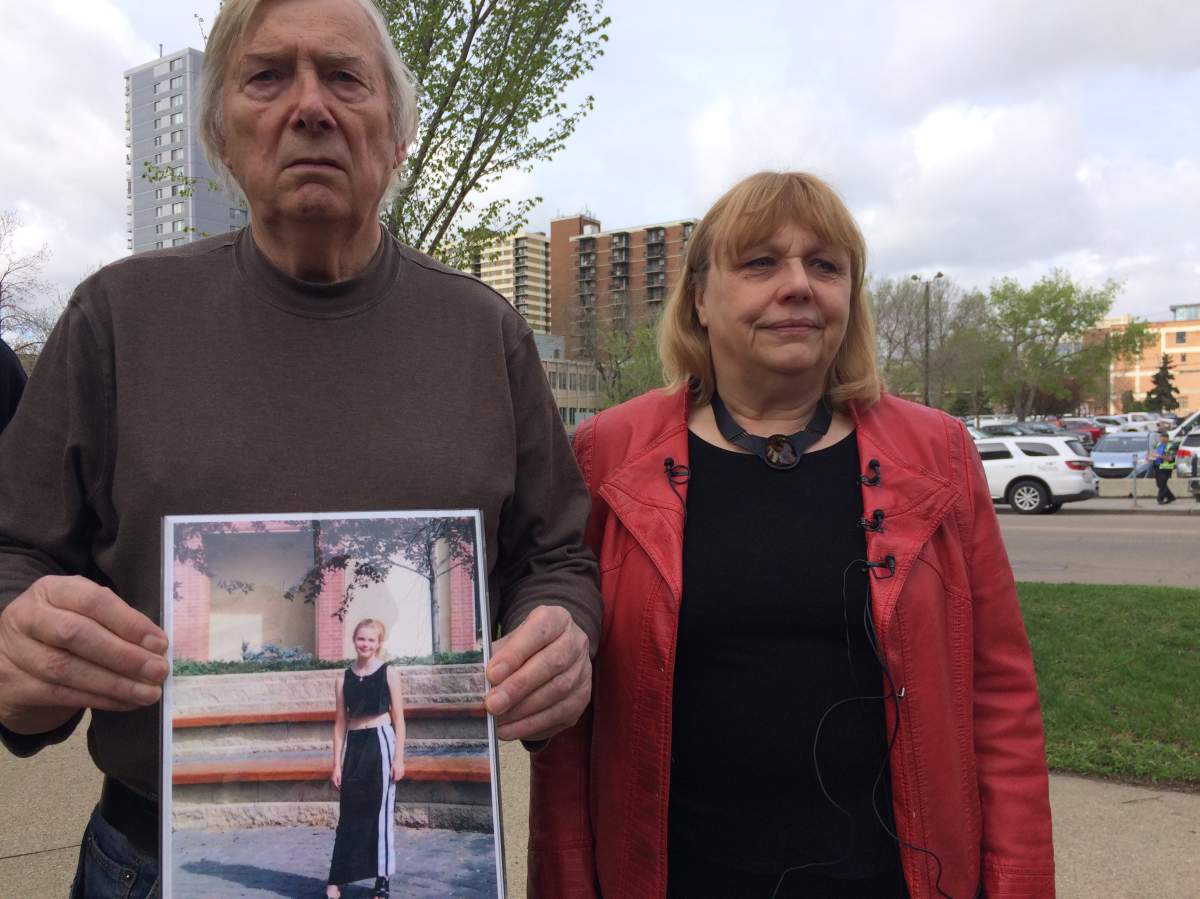 Amber Wilson’s mom Marty Juknevic, right, and stepdad Bill Wilson, left, holding a missing persons poster of her daughter Amber Wilson, who was last seen one year ago in downtown Edmonton. Monday, May 15, 2017.