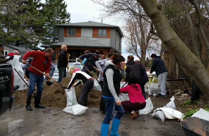 Residents living along Cedar Crest Beach in Bowmanville prepare sand bags on April 30, 2017.