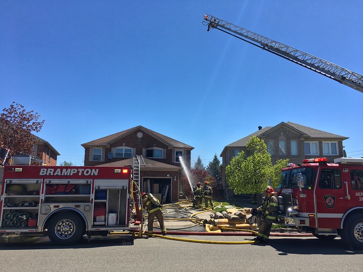 Brampton firefighters attend to a house fire on Mount Fuji Crescent on May 15, 2017.