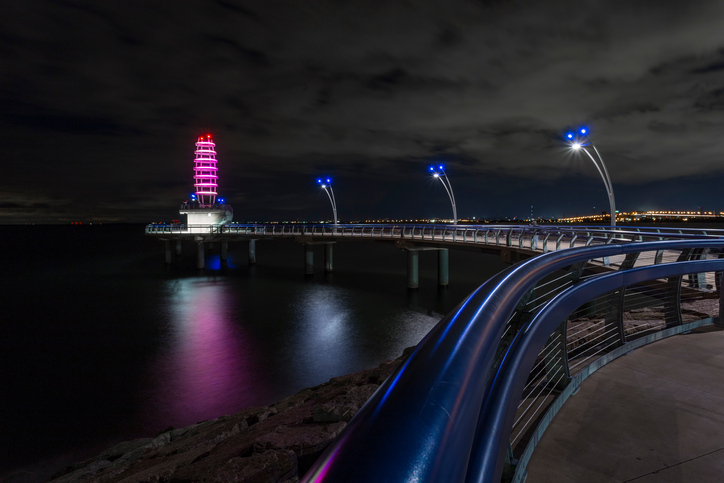 Brant Street Pier located in Burlington, Ontario. Taken at night showing off its LED colour display during the summer.