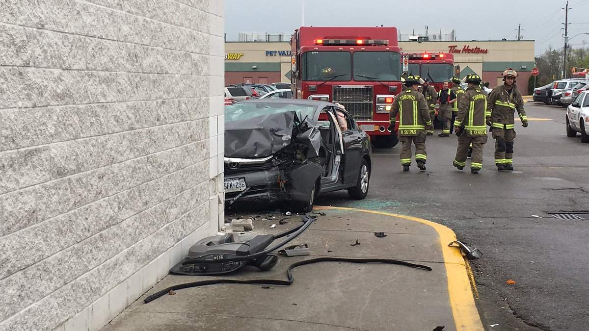Toronto police say an elderly woman received life-threatening injuries after her car crashed into the corner of large retail store in Scarborough.
