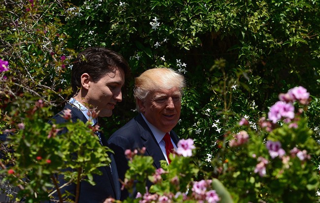 Prime Minister Justin Trudeau and U.S. President Donald Trump walk together during the G7 Summit in Taormina, Italy last week.