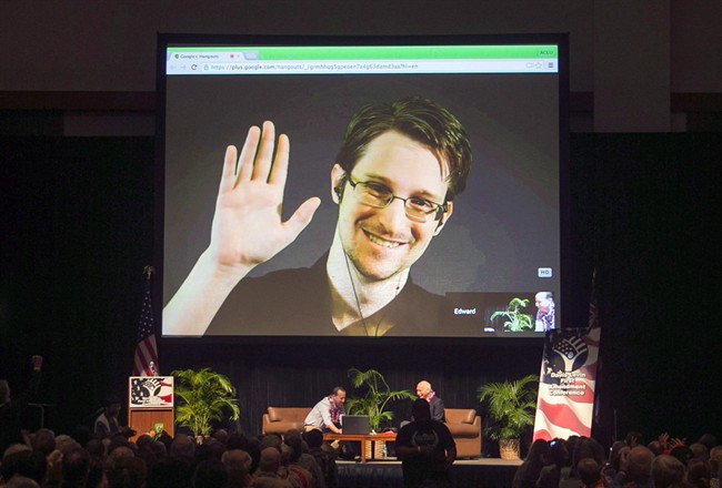 Edward Snowden appears on a live video feed broadcast from Moscow at an event sponsored by ACLU Hawaii in Honolulu on Feb. 14, 2015. 