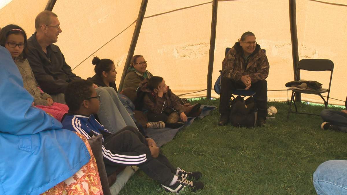 Community elders share traditional teachings at an indigenous culture camp Saturday.
