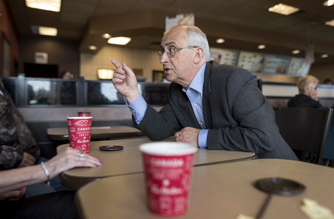 Nova Scotia NDP leader Gary Burrill speaks with people at a Tim Hortons during a campaign stop in Halifax on Friday, May 5, 2017.