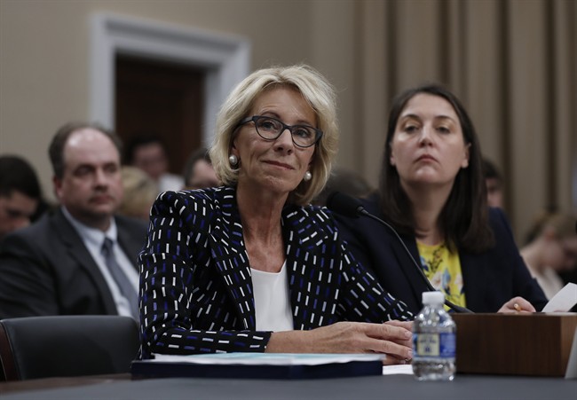 Education Secretary Betsy DeVos, left, joined by Education Department Budget Service Director Erica Navarro, testifies on Capitol Hill in Washington, Wednesday, May 24, 2017, before the House Appropriations Labor, Health and Human Services, Education, and Related Agencies subcommittee hearing on the Education Department's fiscal 2018 budget.