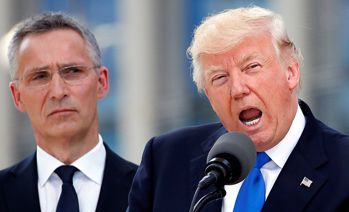 U.S. President Donald Trump speaks beside NATO Secretary General Jens Stoltenberg at the start of the NATO summit at their new headquarters in Brussels, Belgium, May 25, 2017.  