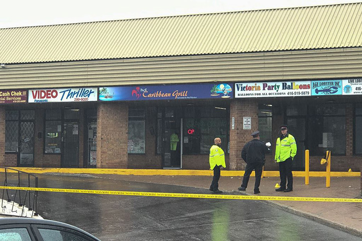 Two men were shot outside a plaza in Scarborough.