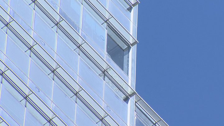 A missing glass panel is seen on the RBC building in downtown Toronto on May 20, 2017.