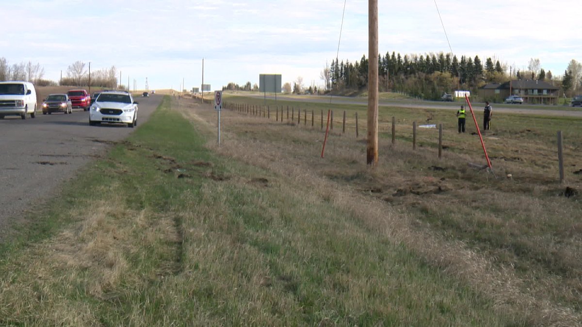 RCMP at the scene of a fatal crash on Highway 2A near Okotoks Saturday. 